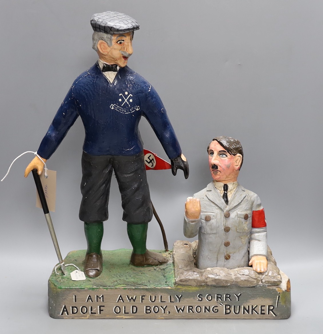 A carved and painted wood anti-Hitler caricature group, 47cm high